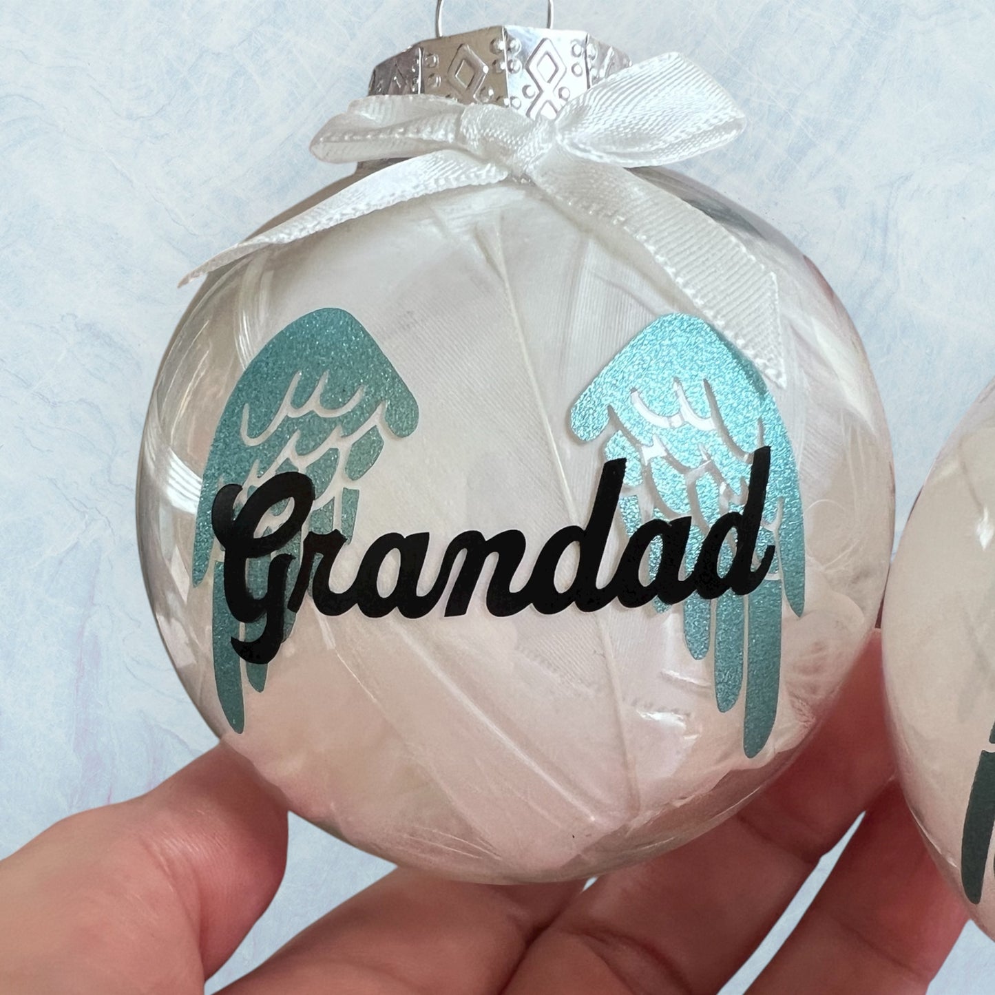 Personalised feather filled memorial baubles